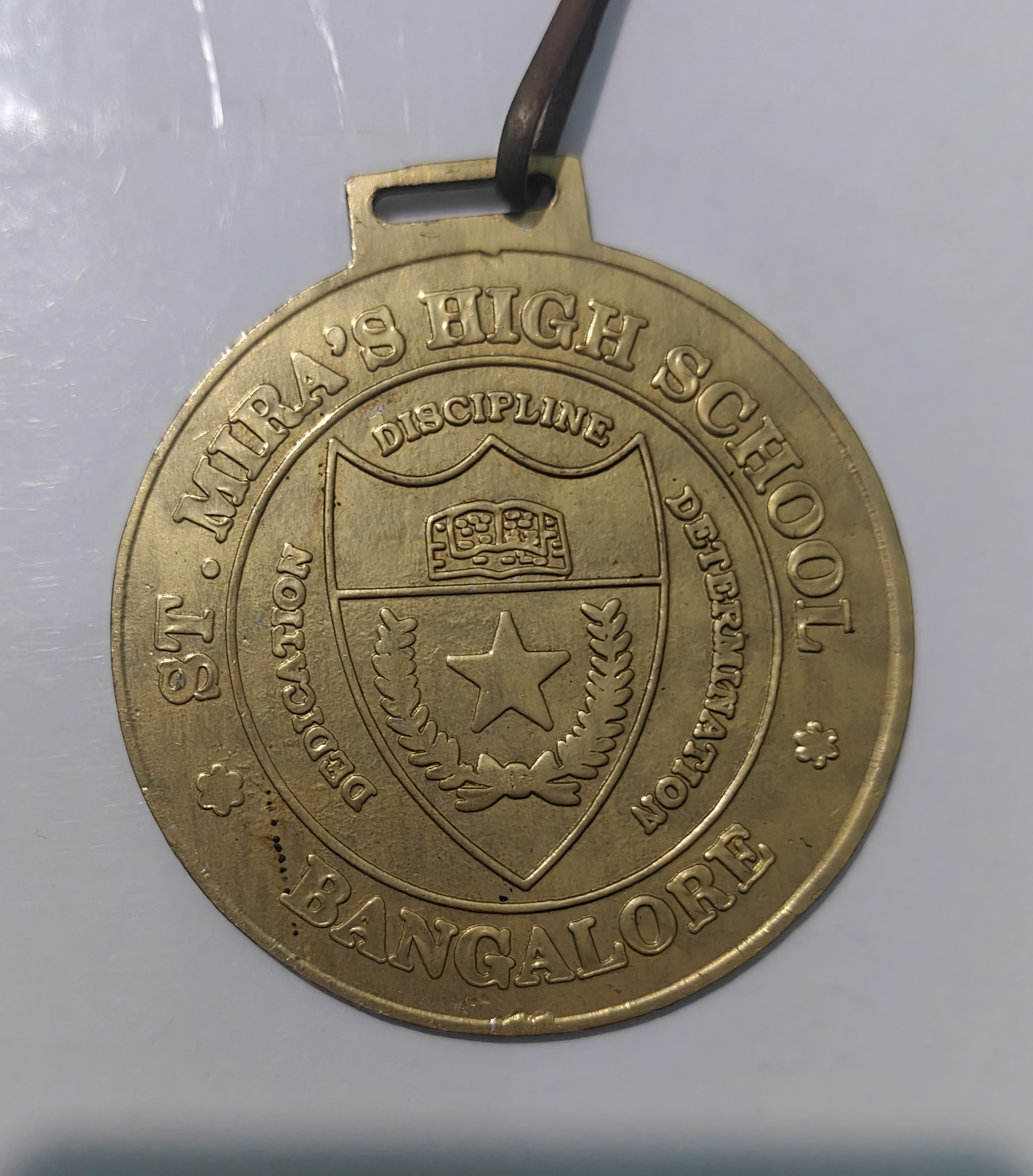Official 1st place gold medal from St. Mira's High School Bangalore.